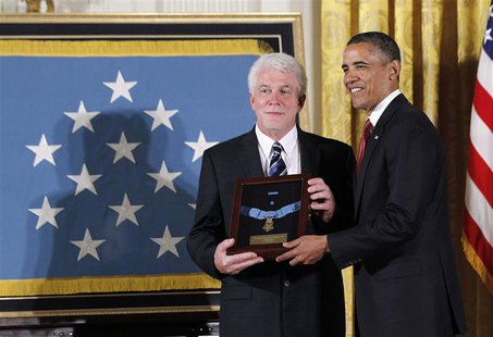 U.S. President Barack Obama participates in a Medal of Honor ceremony for U.S. Army Chaplain Emil Kapaun, accepted posthumously by his nephe U.S. President Barack Obama participates in a Medal of Honor ceremony for U.S. Army Chaplain Emil Kapaun, accepted posthumously by his nephe