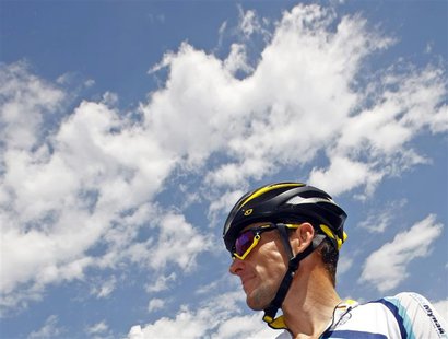 Astana rider Lance Armstrong of the U.S. awaits the start of the 19th stage of the 96th Tour de France cycling race between Bourgoin-Jailleu Astana rider Lance Armstrong of the U.S. awaits the start of the 19th stage of the 96th Tour de France cycling race between Bourgoin-Jailleu