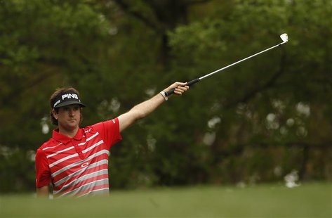 Defending champion Bubba Watson of the U.S. gestures after hitting his tee shot on the fourth hole during first round play in the 2013 Maste Defending champion Bubba Watson of the U.S. gestures after hitting his tee shot on the fourth hole during first round play in the 2013 Maste