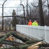 Workers clean up debris in Appleton April 11, 2013, one day after an ice storm. (courtesy of FOX 11).