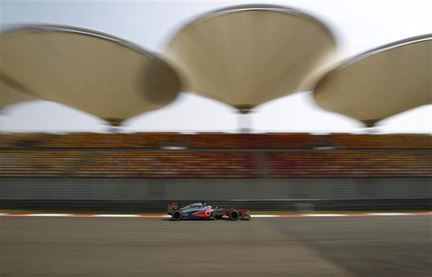 McLaren Formula One driver Jenson Button of Britain drives during the first practice session of the Chinese F1 Grand Prix at the Shanghai In McLaren Formula One driver Jenson Button of Britain drives during the first practice session of the Chinese F1 Grand Prix at the Shanghai In