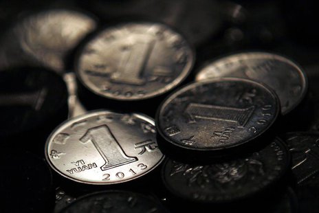One Chinese yuan coins are seen in this photo illustration taken in Shanghai April 7, 2013. REUTERS/Carlos Barria One Chinese yuan coins are seen in this photo illustration taken in Shanghai April 7, 2013. REUTERS/Carlos Barria