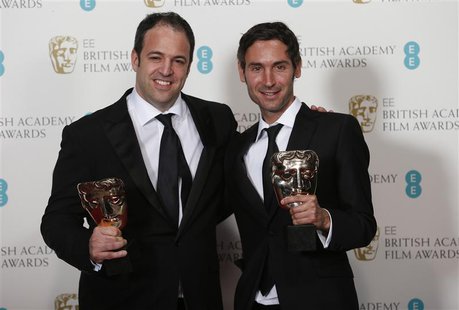 Simon Chinn (L) and Malik Bendjelloul celebrate winning Best Documentary award for "Searching for Sugar Man" at the British Academy of Film Simon Chinn (L) and Malik Bendjelloul celebrate winning Best Documentary award for "Searching for Sugar Man" at the British Academy of Film