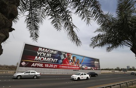 Vehicles travel past a large Bahrain Formula One advertising billboard on main highway leading to Bahrain Internaitonal Circuit, in Manama A Vehicles travel past a large Bahrain Formula One advertising billboard on main highway leading to Bahrain Internaitonal Circuit, in Manama A