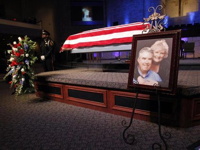 A photograph is displayed at a memorial service for Kaufman County district attorney Mike McLelland and his wife Cynthia in Sunnyvale, Texas A photograph is displayed at a memorial service for Kaufman County district attorney Mike McLelland and his wife Cynthia in Sunnyvale, Texas