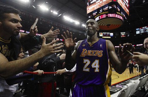 Los Angeles Lakers shooting guard Kobe Bryant (24) leaves the court after scoring 47 points against the Portland Trail Blazers after their N Los Angeles Lakers shooting guard Kobe Bryant (24) leaves the court after scoring 47 points against the Portland Trail Blazers after their N