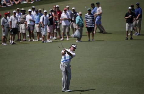 Defending champion Bubba Watson of the U.S. chips to the second green during second round play in the 2013 Masters golf tournament at the Au Defending champion Bubba Watson of the U.S. chips to the second green during second round play in the 2013 Masters golf tournament at the Au