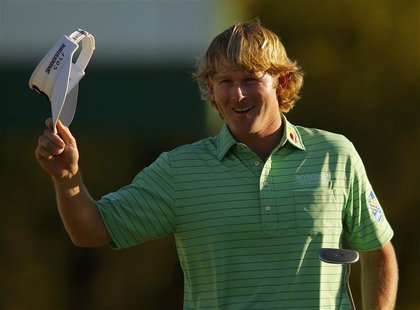 Brandt Snedeker of the U.S. waves after sinking a par putt on the 18th green during third round play in the 2013 Masters golf tournament at Brandt Snedeker of the U.S. waves after sinking a par putt on the 18th green during third round play in the 2013 Masters golf tournament at