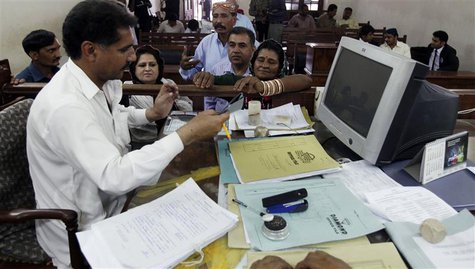 Veero Kolhi (C), a freed bonded labourer turned election candidate, receives her election nomination papers at the district court in the cit Veero Kolhi (C), a freed bonded labourer turned election candidate, receives her election nomination papers at the district court in the cit