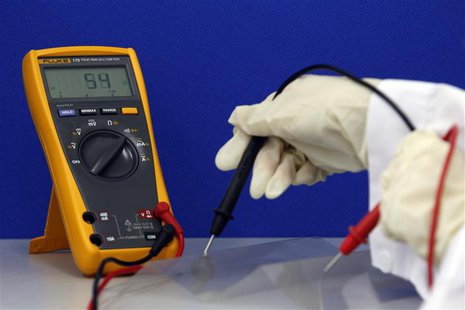 A Cima NanoTech employee tests the conductivity of a piece of folded SANTE Film in their lab in Singapore in this April 12, 2013 picture. RE A Cima NanoTech employee tests the conductivity of a piece of folded SANTE Film in their lab in Singapore in this April 12, 2013 picture. RE