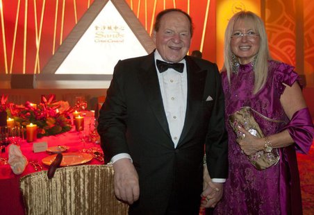 Las Vegas Sands Chairman and CEO Sheldon Adelson and his wife Miriam Ochsorn (R) pose for a photo during the opening ceremony of Sheraton Ma Las Vegas Sands Chairman and CEO Sheldon Adelson and his wife Miriam Ochsorn (R) pose for a photo during the opening ceremony of Sheraton Ma