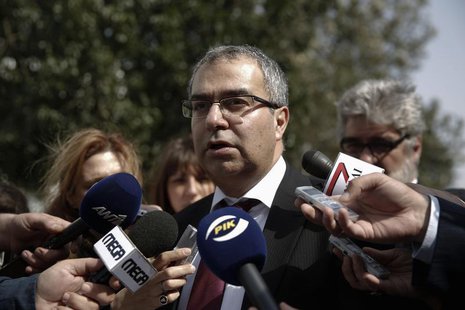 Cyprus Central Bank Governor Panicos Demetriades makes statements outside the parliament in Nicosia March 22, 2013. REUTERS/Yorgos Karahalis Cyprus Central Bank Governor Panicos Demetriades makes statements outside the parliament in Nicosia March 22, 2013. REUTERS/Yorgos Karahalis