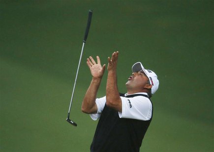 Angel Cabrera of Argentina flips his putter after missing a birdie putt on the second playoff hole during the 2013 Masters golf tournament a Angel Cabrera of Argentina flips his putter after missing a birdie putt on the second playoff hole during the 2013 Masters golf tournament a