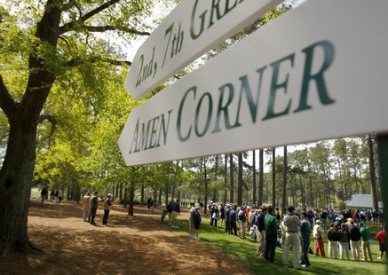 A sign points the way to the famed Amen Corner as patrons watch a practice round for the 2009 Masters golf tournament at the Augusta Nationa A sign points the way to the famed Amen Corner as patrons watch a practice round for the 2009 Masters golf tournament at the Augusta Nationa