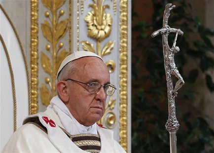 Pope Francis holds a cross as he leads a solemn mass at Saint Paul's Basilica in Rome April 14, 2013. REUTERS/Max Rossi Pope Francis holds a cross as he leads a solemn mass at Saint Paul's Basilica in Rome April 14, 2013. REUTERS/Max Rossi