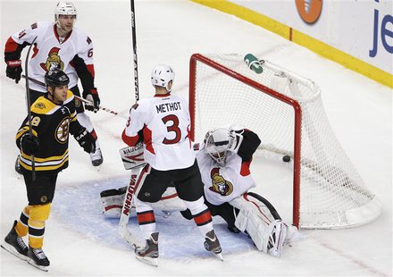 Ottawa Senators' Andrew Benoit (L) looks on as Boston Bruins' Nathan Horton celebrates his goal while Senators' Marc Methot (2nd R) watches Ottawa Senators' Andrew Benoit (L) looks on as Boston Bruins' Nathan Horton celebrates his goal while Senators' Marc Methot (2nd R) watches