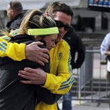 A woman is comforted by a man near a triage tent set up for the Boston Marathon after explosions went off at the 117th Boston Marathon in Boston, Massachusetts April 15, 2013. (Reuters)