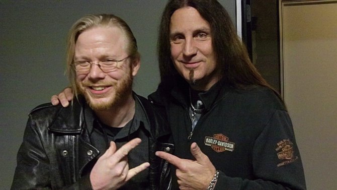 L-R: Terry Stevens and Jesse James throwing up horns.