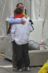 Members of the Boston Marathon medical team embrace after treating victims of explosions near the finish line of the Boston Marathon in Bost Members of the Boston Marathon medical team embrace after treating victims of explosions near the finish line of the Boston Marathon in Bost