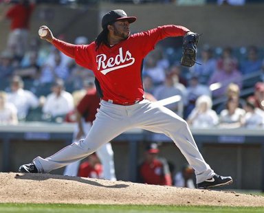 Cincinnati Reds starting pitcher Johnny Cueto delivers a pitch against the Arizona Diamondbacks during the first inning of their MLB Cactus Cincinnati Reds starting pitcher Johnny Cueto delivers a pitch against the Arizona Diamondbacks during the first inning of their MLB Cactus