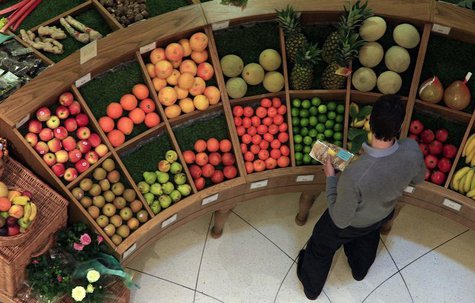 A customer looks at fruit in a store in central London April 12, 2011. REUTERS/Stefan Wermuth A customer looks at fruit in a store in central London April 12, 2011. REUTERS/Stefan Wermuth