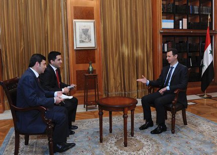 Syria's President Bashar al-Assad (R) speaks during an interview with the Turkish media in Damascus, in this handout photograph distributed Syria's President Bashar al-Assad (R) speaks during an interview with the Turkish media in Damascus, in this handout photograph distributed