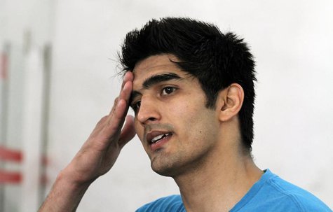 Indian boxer Vijender Singh reacts during an interview at Karnail Singh stadium in New Delhi April 2, 2012. REUTERS/Parivartan Sharma Indian boxer Vijender Singh reacts during an interview at Karnail Singh stadium in New Delhi April 2, 2012. REUTERS/Parivartan Sharma