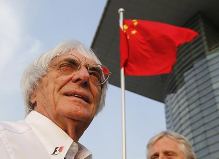 Formula One supremo Bernie Ecclestone is seen in front of Chinese national flag at a paddock after the qualifying session for the Chinese F1 Formula One supremo Bernie Ecclestone is seen in front of Chinese national flag at a paddock after the qualifying session for the Chinese F1