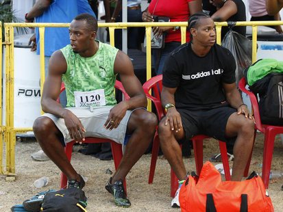 Jamaican runners Usain Bolt (L) and Yohan Blake prepare to run in the men's 400m race of the Camperdown Classic, an annual track event in it Jamaican runners Usain Bolt (L) and Yohan Blake prepare to run in the men's 400m race of the Camperdown Classic, an annual track event in it