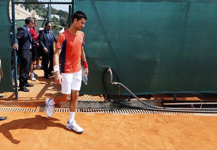 Novak Djokovic of Serbia arrives for a training session during the first round of the Monte Carlo Masters in Monaco April 16, 2013. REUTERS/ Novak Djokovic of Serbia arrives for a training session during the first round of the Monte Carlo Masters in Monaco April 16, 2013. REUTERS/
