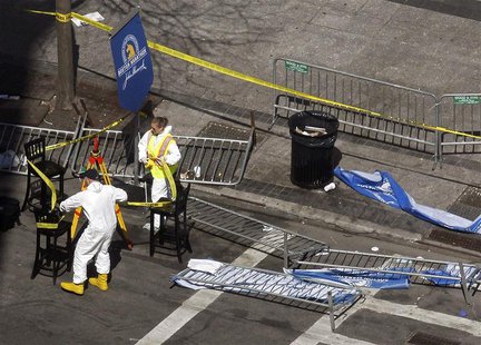 Officials wrap crime scene tape around an area on Boylston Street a day after two explosions at the Boston Marathon in Boston, Massachusetts Officials wrap crime scene tape around an area on Boylston Street a day after two explosions at the Boston Marathon in Boston, Massachusetts