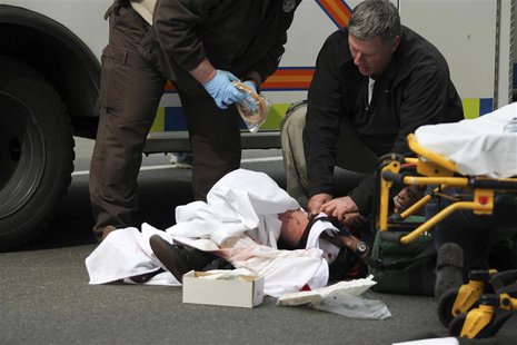 A victim is attended to at the scene of an explosion at the Boston Marathon in Boston, Massachusetts, April 15, 2013. REUTERS/Daily Free Pre A victim is attended to at the scene of an explosion at the Boston Marathon in Boston, Massachusetts, April 15, 2013. REUTERS/Daily Free Pre