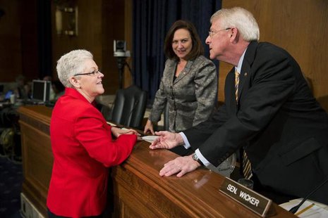 Gina McCarthy speaks with U.S. Senators Deb Fischer (R-NE) and Roger Wicker (R-MS) prior to testifying before the Senate Environment and Pub Gina McCarthy speaks with U.S. Senators Deb Fischer (R-NE) and Roger Wicker (R-MS) prior to testifying before the Senate Environment and Pub