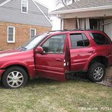 Vehicle slams into house in Menasha on April 15, 2013. Vehicle slams into house in Menasha on April 15, 2013.