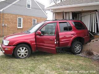 Vehicle slams into house in Menasha on April 15, 2013. Vehicle slams into house in Menasha on April 15, 2013.