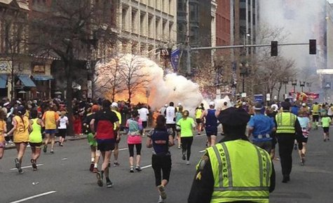 The first bomb blast stuns runners and injures dozens of fans and family members. (Reuters) The first bomb blast stuns runners and injures dozens of fans and family members. (Reuters)