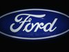 Ford cars are reflected in the company's logo at the carmakers' booth on media day at the Paris Mondial de l'Automobile, September 28, 2012.