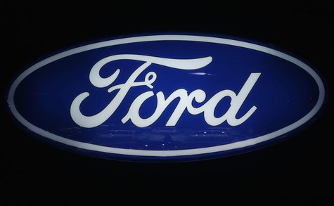 Ford cars are reflected in the company's logo at the carmakers' booth on media day at the Paris Mondial de l'Automobile, September 28, 2012. Ford cars are reflected in the company's logo at the carmakers' booth on media day at the Paris Mondial de l'Automobile, September 28, 2012.