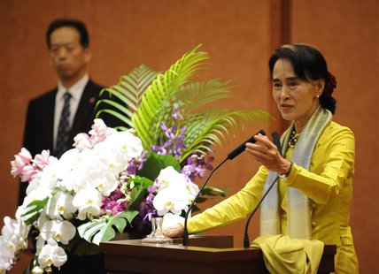 Nobel laureate and Myanmar opposition leader Aung San Suu Kyi (R) answers a question from a student during her lecture session at the Univer Nobel laureate and Myanmar opposition leader Aung San Suu Kyi (R) answers a question from a student during her lecture session at the Univer