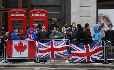 Spectators gather on the route to watch the funeral procession of former British prime minister Margaret Thatcher, near St Paul's Cathedral Spectators gather on the route to watch the funeral procession of former British prime minister Margaret Thatcher, near St Paul's Cathedral
