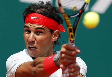 Rafael Nadal of Spain returns the ball to Marinko Matosevic of Australia during the Monte Carlo Masters in Monaco April 17, 2013. REUTERS/Er Rafael Nadal of Spain returns the ball to Marinko Matosevic of Australia during the Monte Carlo Masters in Monaco April 17, 2013. REUTERS/Er