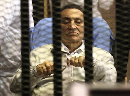 Egypt's ousted President Hosni Mubarak sits inside a dock at the police academy on the outskirts of Cairo April 15, 2013. REUTERS/Stringer Egypt's ousted President Hosni Mubarak sits inside a dock at the police academy on the outskirts of Cairo April 15, 2013. REUTERS/Stringer