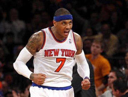 New York Knicks forward Carmelo Anthony reacts after hitting a three-point shot against the Indiana Pacers in the second half of their NBA b New York Knicks forward Carmelo Anthony reacts after hitting a three-point shot against the Indiana Pacers in the second half of their NBA b