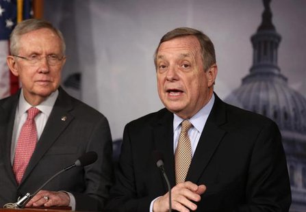 Senator Dick Durbin (D-IL) speaks next to Senate Majority Leader Harry Reid (D-NV) (L) at a news conference on Capitol Hill in Washington Fe Senator Dick Durbin (D-IL) speaks next to Senate Majority Leader Harry Reid (D-NV) (L) at a news conference on Capitol Hill in Washington Fe