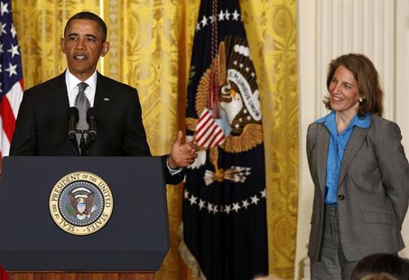 U.S. President Barack Obama stands next to Sylvia Mathews Burwell, head of the Walmart Foundation, while nominating her to become director o U.S. President Barack Obama stands next to Sylvia Mathews Burwell, head of the Walmart Foundation, while nominating her to become director o