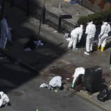 Officials take crime scene photos two days after two explosions hit the Boston Marathon in Boston, Massachusetts April 17, 2013. REUTERS/Sha