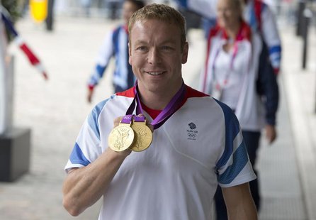 Olympic cyclist Chris Hoy poses for photographers as he arrives for a reception for British Olympic and Paralympic athletes in London Septem Olympic cyclist Chris Hoy poses for photographers as he arrives for a reception for British Olympic and Paralympic athletes in London Septem