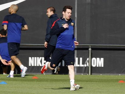Barcelona's Lionel Messi runs on the pitch during a training session at Ciutat Esportiva Joan Gamper in Sant Joan Despi, near Barcelona Apri Barcelona's Lionel Messi runs on the pitch during a training session at Ciutat Esportiva Joan Gamper in Sant Joan Despi, near Barcelona Apri