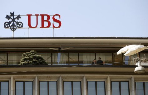 People stand on a terrace of an office building of Swiss bank UBS at the Paradeplatz square in Zurich April 18, 2013. REUTERS/Arnd Wiegmann People stand on a terrace of an office building of Swiss bank UBS at the Paradeplatz square in Zurich April 18, 2013. REUTERS/Arnd Wiegmann