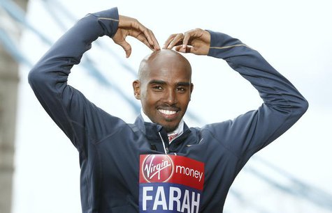 Britain's double Olympic champion Mo Farah makes his trademark "Mobot" pose for photographers during a media event for the London Marathon, Britain's double Olympic champion Mo Farah makes his trademark "Mobot" pose for photographers during a media event for the London Marathon,